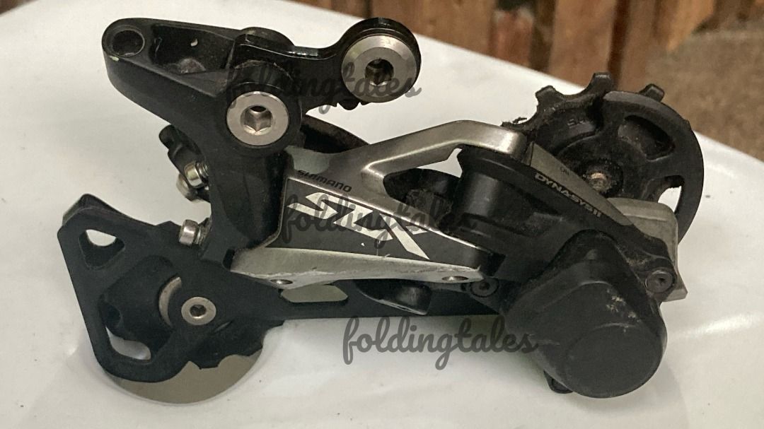 MTB 11s mini groupset and other parts (Category: Bicycles) located in Quezon City. Submitted by i4nt4n (Listing ID 1398747034, Image 2). Description: 1x11 groupset - crankset - xt fc-m8000 175mm 34t no BB - rear derailleur - slx rd-m7000 - right shifter - xt sl-m8000 - cassette - xt cs-m8000 11-46t - front derailleur - xt fd-m8000 Other parts - 1 esi grips (black) - 1 wolftooth grips (red-orange) - 1 zitto pedal (Purple) - 1 stem (no brand) - 1 w