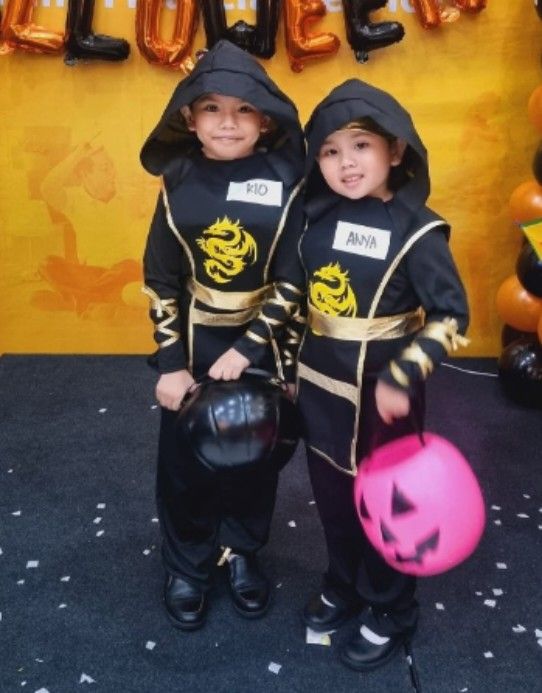 Ninja Costume for Kids (Medium) (Category: Babies & Kids Fashion) located in Quezon City. Submitted by itsfin (Listing ID 1398854336, Image 1). Description: - Ninja costume for kids! - Includes hooded top, pants, and face covering. - Color: Black with gold accents. - Available sizes: S and M - Please refer to the size chart - Perfect for Halloween or dress-up! I have 2 kids. Small P450.00 Medium P550.00.
