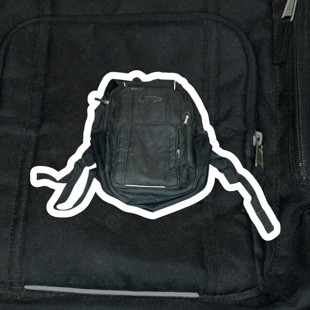 Oakley Black Utility Tactical Backpack / Small Laptop Bag - Durable Design (Category: Backpacks) located in Paranaque City. Submitted by thepopneverstops (Listing ID 1398752239, Image 2). Description: Black utility tactical backpack with durable design. Features multiple compartments including laptop sleeve. Practical for work, travel, or outdoor activities. ❌video ❌when worn pics ❌lowball ❌cod Tags: tactical backpack, utility bag, laptop bag, bl