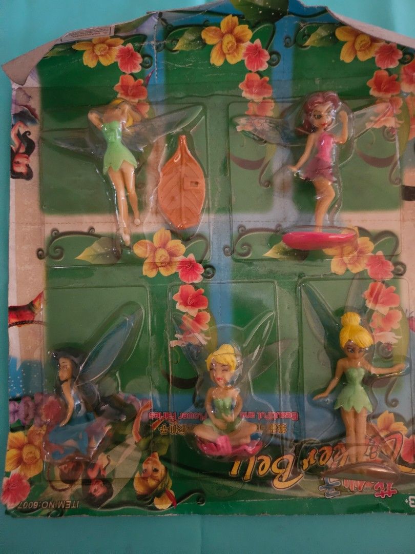 Tinker Bell Toy Figures (Category: Figurines & Statues) located in Quezon City. Submitted by lizawoo (Listing ID 1398788117, Image 1). Description: - Vintage Tinker Bell figures - Still in original packaging - Features Tinker Bell in various poses - Different colored outfits - Packaging with floral designs - Includes the Tinker Bell logo good for cake topper too.