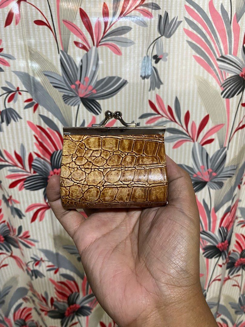 VINTAGE CROCODILE EMBOSSED COIN PURSE (Category: Wallets & Card holders) located in Lucena. Submitted by ojfinds (Listing ID 1398869050, Image 1). Description: ‼️FOR SALE‼️ VINTAGE CROCODILE EMBOSSED COIN PURSE Vintage coin purse Crocodile-embossed exterior Metal frame and clasp Red fabric lining Small size Condition : 9/10 Perfect for coins and small items.