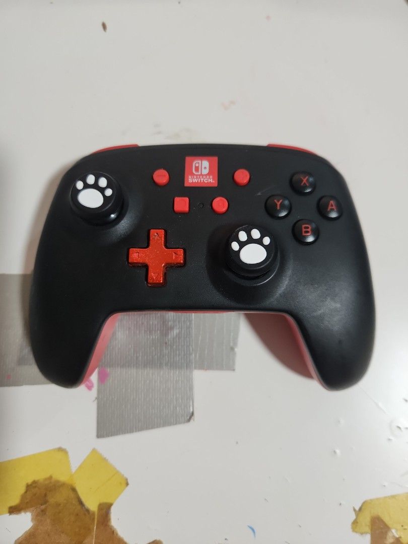 Wireless Nintendo Switch Pro controller (Category: Controllers) located in Singapore. Submitted by morolume (Listing ID 1398782869, Image 1). Description: PowerA Enhanced Wireless Nintendo Switch Pro Controller 🌟FREE paw print joystick cover 🌟 Compatible with all Nintendo Switch/switch lite/switch 2 🌟Tested and fully functional controller only (no box) runs on 2 AA battery feel free to meetup and test out on ur switch or i can bring mine for y