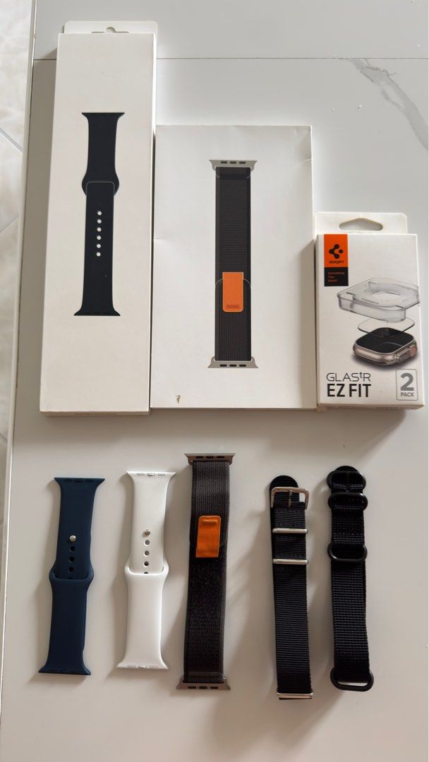Apple Watch Straps and Screen Protector (Category: Wearables & Smart Watches) located in Las Pinas. Submitted by mindlessghost (Listing ID 1398874668, Image 1). Description: SELLING AS BUNDLE OR INDIVIDUAL Includes: - Apple Trail Loop Band S/M 49mm (With box, brand new) - 3,000 - Apple Trail Loop Band S/M 49mm (No box) - 2,000 - Apple Midnight Silicone Sport band 45mm (With box, brand new) - 1,500 - Apple Navy Blue Silicone Sport Band (45mm No bo