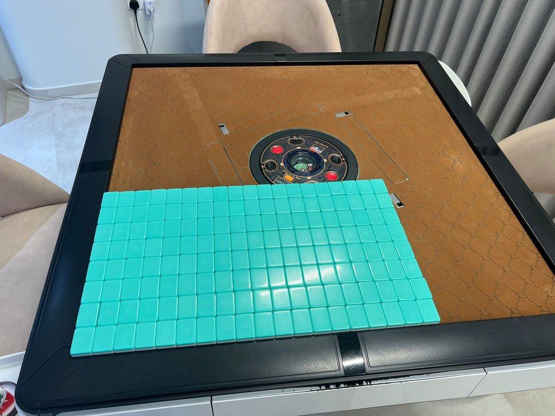 Automatic mahjong table (Category: Interactive Toys) located in Singapore. Submitted by denonsia (Listing ID 1399035293, Image 3). Description: Excellent working condition used mahjong table for sale ! Original price is one k from a local Singapore supplier , not from taobao . Model is gen3 from Funtown . Full table servicing done . Sleek design . The table base has some peeled off paint and drawers with colour discolorations - this is very commo