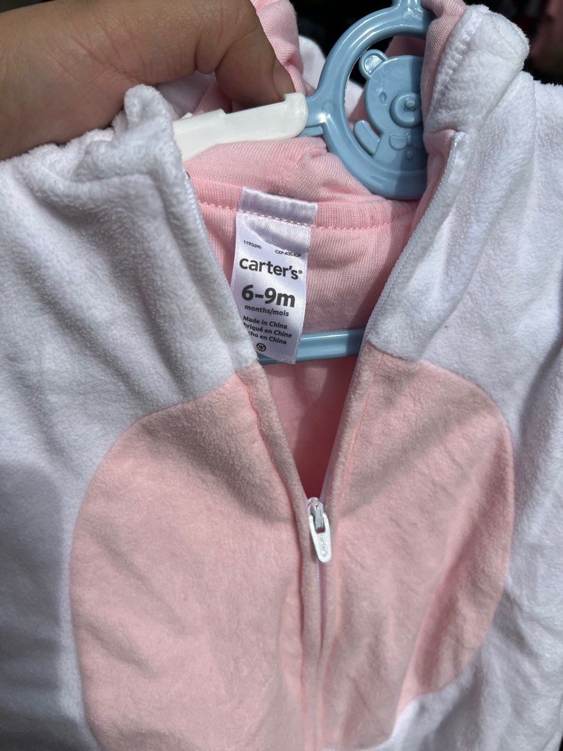 Carter's Unicorn Onesie 6-9 Months (Category: Babies & Kids Fashion) located in Quezon City. Submitted by zaria22 (Listing ID 1398921802, Image 2). Description: - Carter's unicorn onesie for babies (6-9 months). - Soft, plush white and pink design. - Features a hood and zipper closure. - Includes a unicorn horn and ears. - Perfect for costumes or everyday wear. - Needs wash.