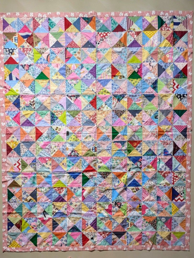 Cotton Patchwork Blanket (Category: Bedding & Towels) located in Singapore. Submitted by hiangneo (Listing ID 1398920166, Image 1). Description: - Cotton Patchwork Blanket. - Patched with 720 pieces of multi-design, multi-colour fabrics. - Sweet pink lucky leaves backing. - Size: 72.5” x 58” (184cm x 147cm) - Cash on collection. .