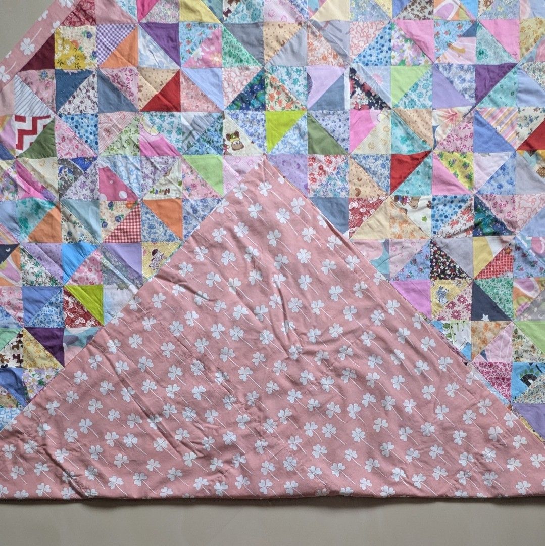 Cotton Patchwork Blanket (Category: Bedding & Towels) located in Singapore. Submitted by hiangneo (Listing ID 1398920166, Image 2). Description: - Cotton Patchwork Blanket. - Patched with 720 pieces of multi-design, multi-colour fabrics. - Sweet pink lucky leaves backing. - Size: 72.5” x 58” (184cm x 147cm) - Cash on collection. .