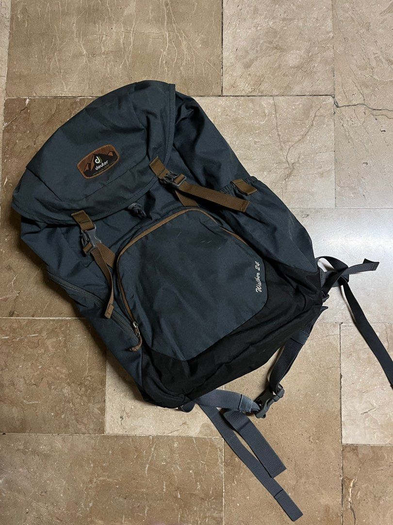 Deuter Walker 24 Backpack (Category: Backpacks) located in Binangonan. Submitted by lv33852 (Listing ID 1398893724, Image 1). Description: - Deuter Walker 24 backpack - Color: Dark Grey - Main compartment with drawstring closure - Front pocket - Side pockets - Deuter Airstripes back system for ventilation - Adjustable shoulder straps and buckles - Deuter logo visible.