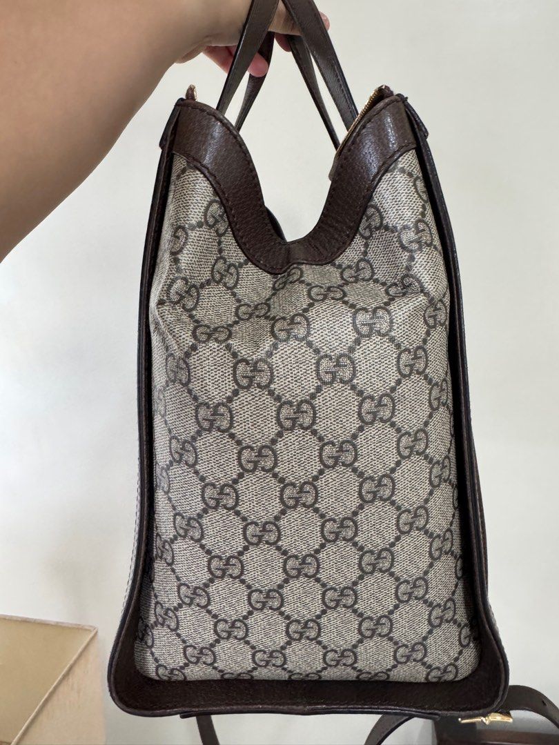 Gucci Ophidia Large Tote Bag (Category: Luxury Bags & Wallets) located in Mandaue City. Submitted by OCgirlscloset (Listing ID 1398869801, Image 3). Description: - Authentic Gucci tote bag - Crafted from iconic GG Supreme canvas - Features brown leather trim and handles - Structured tote bag design - Includes a shoulder strap.
