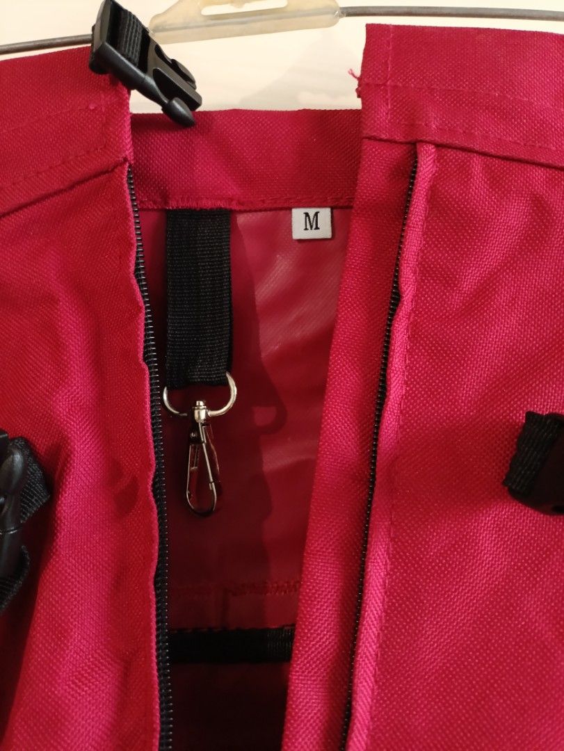 L.D. DOG Pet Carrier Backpack - Size M (Category: Homes & Other Pet Accessories) located in Quezon City. Submitted by catsdeclutter (Listing ID 1398956108, Image 3). Description: - L.D. DOG pet carrier backpack - Color: Red and Black - Size: M (marked inside) - Features: - Mesh side panel for ventilation - Multiple straps for secure carrying - Pocket with L.D. DOG logo - Includes: Clip and small orange buckle.