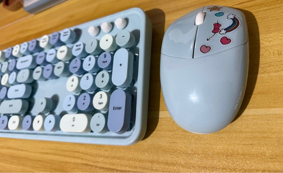 MOFii Wireless Keyboard and Mouse Set (Category: Computer Keyboard) located in San Jose del Monte. Submitted by irenepino06 (Listing ID 1399019475, Image 3). Description: - MOFii wireless keyboard and mouse set - Keyboard features round keys in blue and white - Includes a number pad - Light blue mouse with decorative stickers - Designed for ease of use and a stylish look - Ideal for both work and leisure Still negotiable.