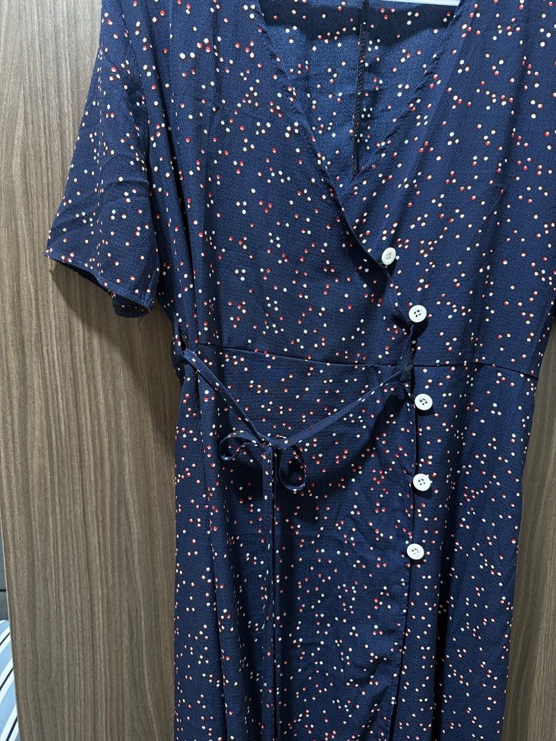 Navy Blue Polka Dot Dress Wrap Around (Category: Dresses) located in Mandaluyong City. Submitted by veronica3000 (Listing ID 1398925086, Image 3). Description: - Navy blue polka dot wrap dress - Short sleeves - Button-down front - Matching tie belt - V-neckline - Midi length - Lightweight fabric - Ideal for warm weather.