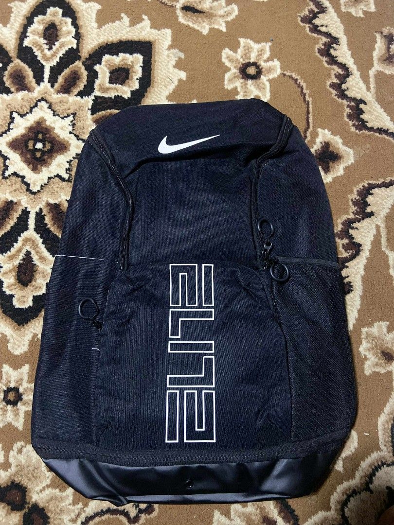 Nike Elite Backpack Black v3 (Category: Backpacks) located in Baguio. Submitted by duldulao23 (Listing ID 1398999839, Image 1). Description: - Nike Elite backpack V3 - Large main compartment - Multiple smaller pockets - Padded shoulder straps and back panel for comfort - "ELITE" printed on the front - Separate bottom compartment - Includes Nike tag.