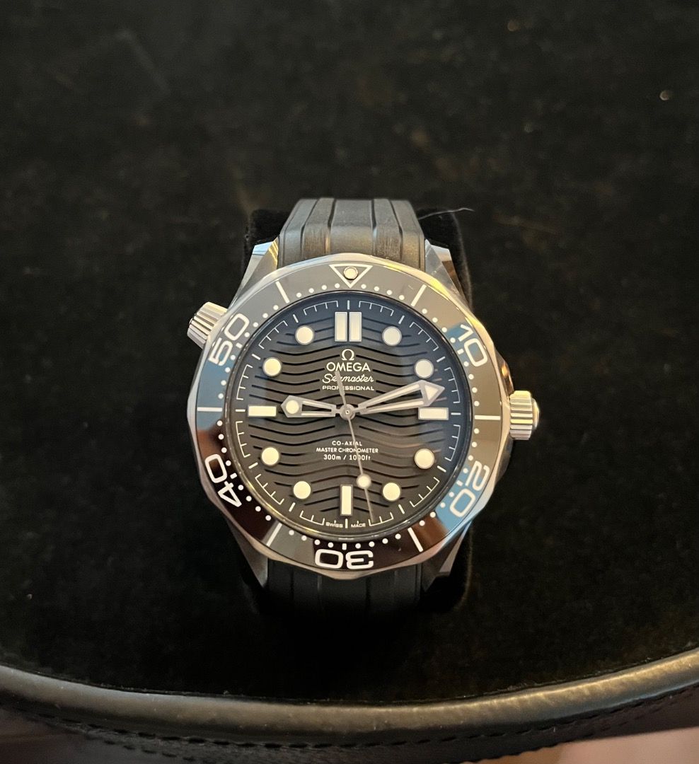 Omega Seamaster Black Ceramic Diver 300M (Category: Luxury Watches) located in Makati City. Submitted by cheeseefungu (Listing ID 1398892402, Image 1). Description: - Bought 2020, watch and box only, NO PAPERS. Can authenticate at watch check before buying - Omega Seamaster Diver 300M Watch - Black dial - Black rubber strap - Stainless steel case - Unidirectional rotating bezel - Presented in an Omega wooden box - Features the Omega logo.