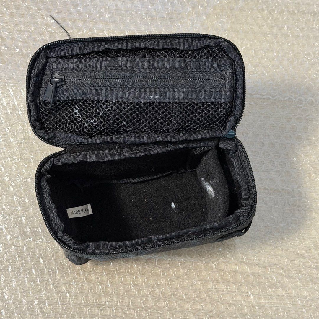 PocketWizard Case (Category: Other Photography Accessories) located in Singapore. Submitted by superseetoh (Listing ID 1398946421, Image 3). Description: - Genuine PocketWizard case - Should be PocketWizard 804-712 G-Wiz Trunk Bag (Black) - Black, zippered design - Features an internal mesh pocket - Minor marks present inside - Ideal for storing PocketWizard equipment.