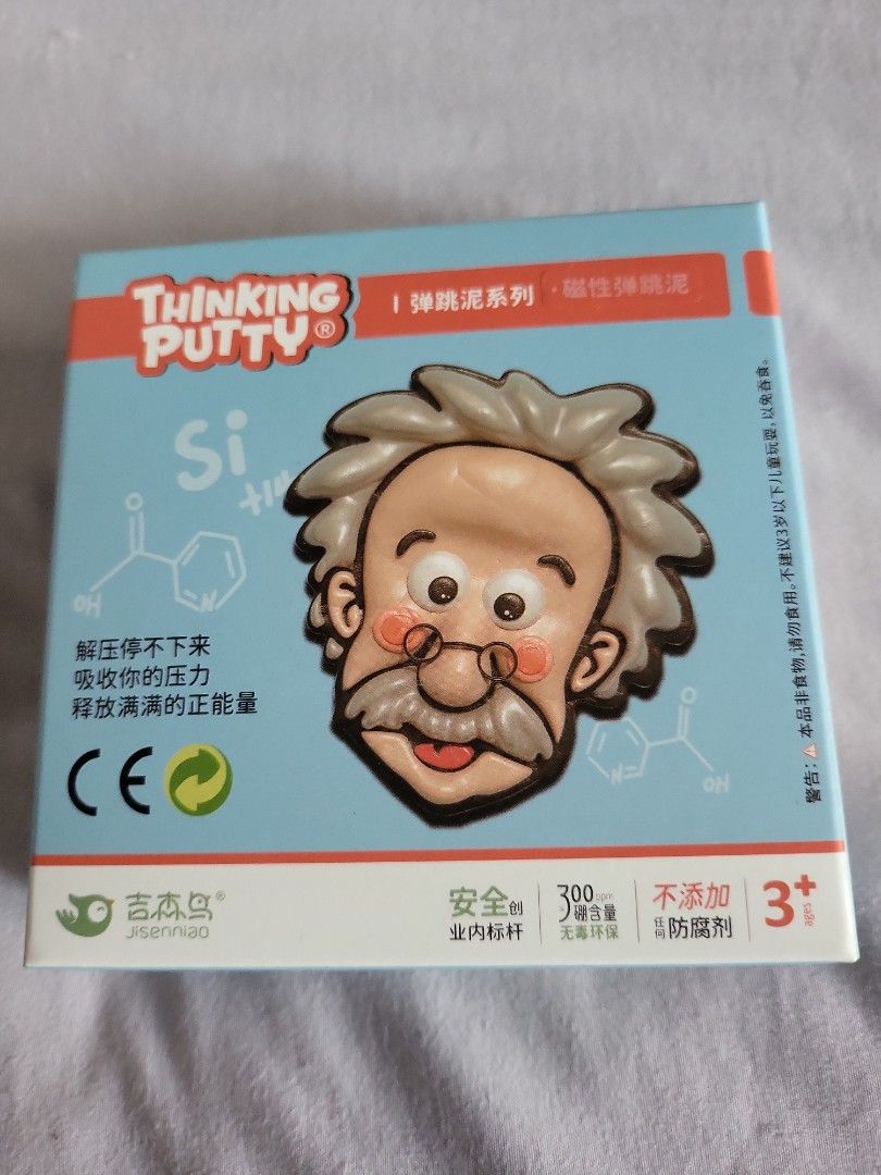 Thinking Putty - Einstein Edition (Category: Educational & Learning Toys) located in Singapore. Submitted by tiger05 (Listing ID 1398972471, Image 1). Description: - Brand new Einstein Thinking Putty set. - Includes putty, a small toy, and a yellow accessory. - Fun and educational! - Perfect for kids aged 3+. - Unopened and ready to play!.