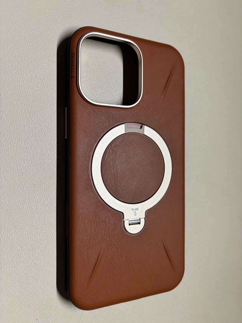 Torras Vegan Leather Stand Case 16PM (Category: Cases & Sleeves) located in Pasig City. Submitted by vince.declutters (Listing ID 1398891182, Image 2). Description: - original torras vegan leather case with stand and camera button for 16 promax - case is used. There are minor dents on the metal part on the camera as sign of usage but overall unnoticeable. See pics attached.
