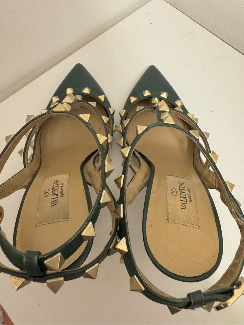 Valentino Garavani Rockstud Heels (Category: Heels) located in Taguig. Submitted by ara_gee (Listing ID 1398981166, Image 3). Description: - Valentino Garavani Rockstud heels - Color: Dark Green - Size: 36.5 - Pointed toe design - Signature gold-tone pyramid studs - T-strap and ankle strap with buckle closure - Valentino Garavani logo on insole - Authentic - No inclusion that’s why selling low -Item in really good condition - Slightly negotiable.