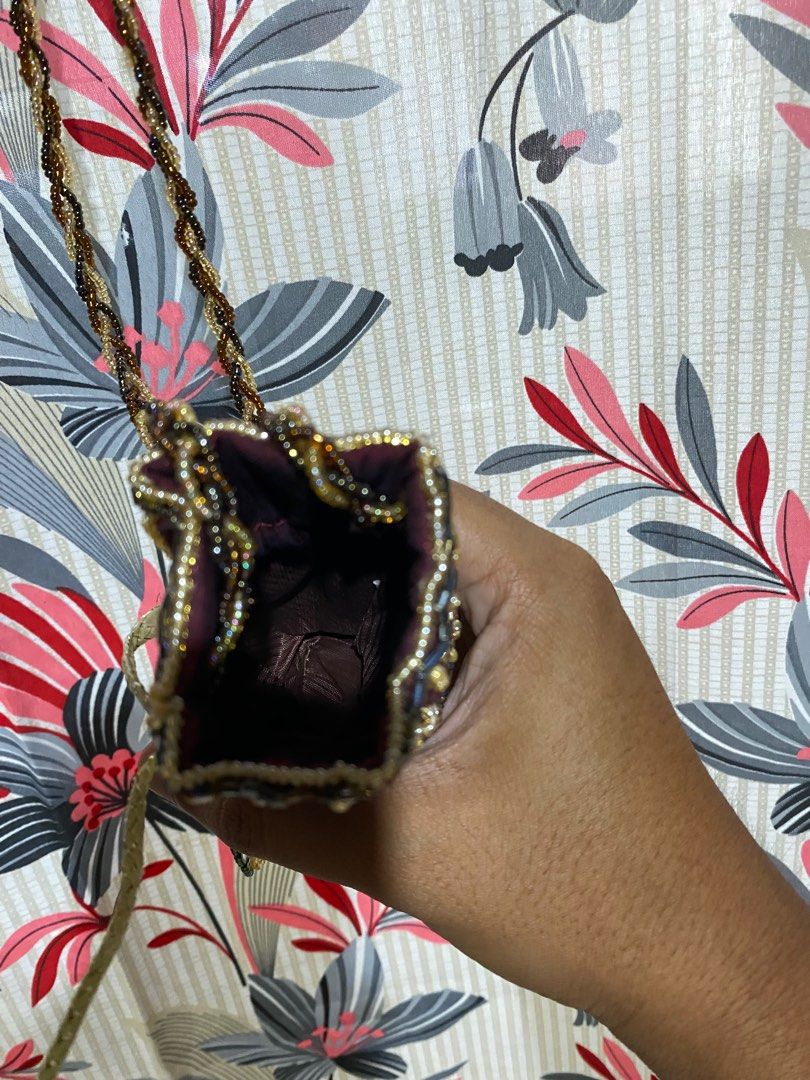VINTAGE BEADED HANDBAG WITH SHOULDER STRAP (Category: Shoulder Bags) located in Lucena. Submitted by ojfinds (Listing ID 1398872699, Image 3). Description: ‼️FOR SALE‼️ VINTAGE BEADED HANDBAG WITH SHOULDER STRAP Colors : Burgundy, gold, and blue Braided shoulder strap Beaded fringe detail Satin-like material Matching burgundy interior Unique and stylish accessory Good condition.