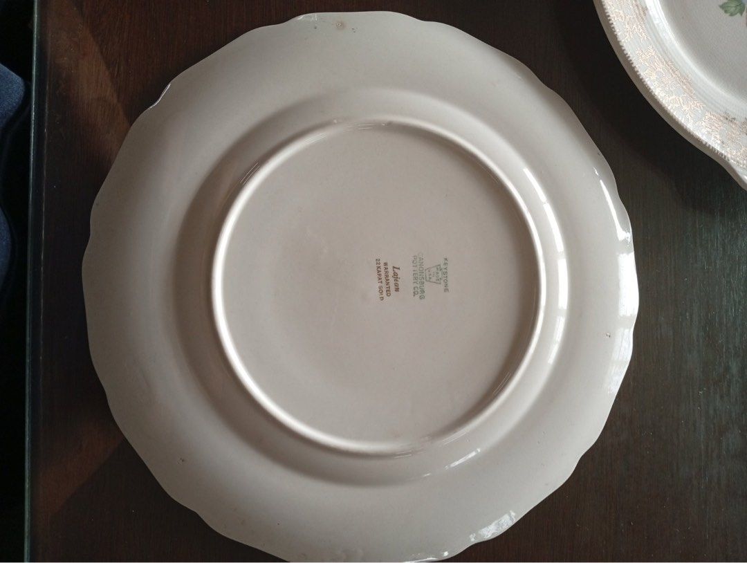 Vintage Lajean Dinner Plate (Category: Dinnerware & Cutlery) located in Bulacan. Submitted by dearphoenix (Listing ID 1399003234, Image 2). Description: - One Vintage dinner plate from Cannonsburg Pottery, USA. - 22k karat gold warranted - Features a floral center design. - Elegant gold-colored, ornate rim. - Scalloped edge. - Brand and model marked on the back. - Perfect for vintage tableware collections. - P1,500 negotiable - For pick up only o