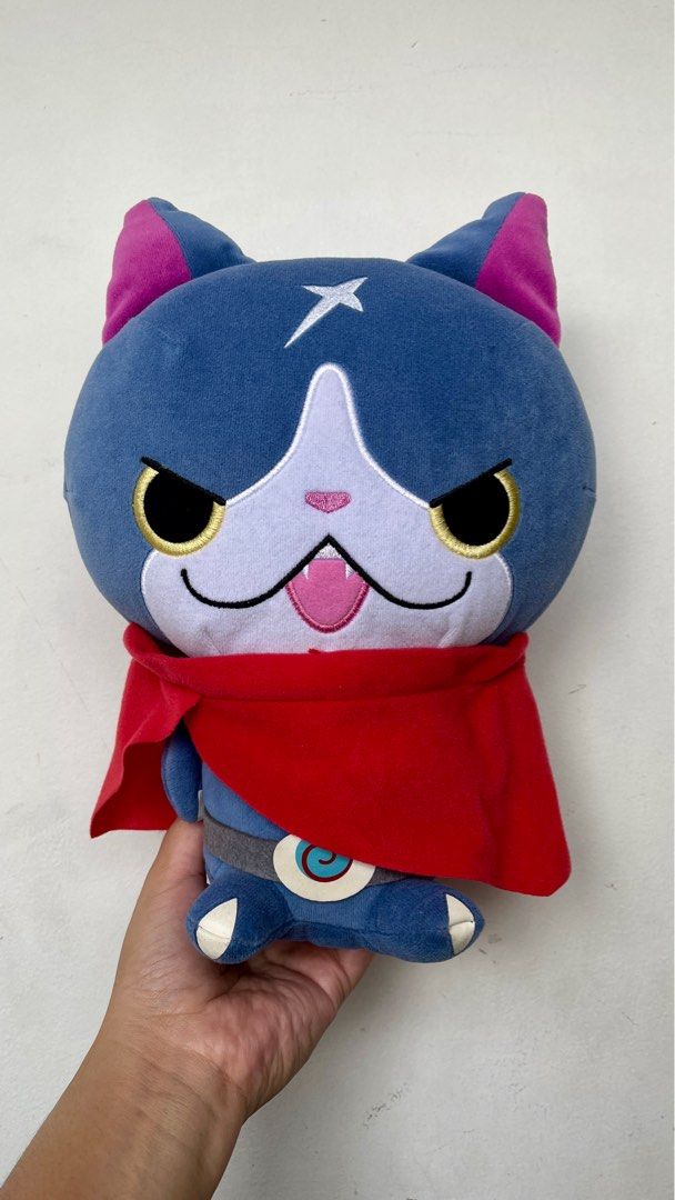 Yo-kai Watch Jibanyan Plush Toy (Category: Plushies & Soft Toys) located in Pasig City. Submitted by 3mjcharmsnplushies (Listing ID 1398905720, Image 1). Description: - Authentic Jibanyan plush toy from Yo-kai Watch. - Features Jibanyan's signature blue and white design. - Includes a vibrant red cape. - Comes with a star marking and belt details. - Official Banpresto product..