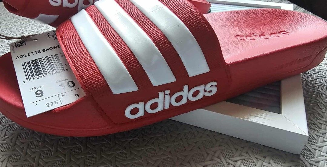 Adidas Adilette Shower Slides - Red (Category: Slippers & Slides) located in Malolos. Submitted by les0802 (Listing ID 1399116836, Image 2). Description: - Adidas Adilette Shower Slides - Color: Red with white stripes - Features Adidas logo - Size: US 9M/ 10W .