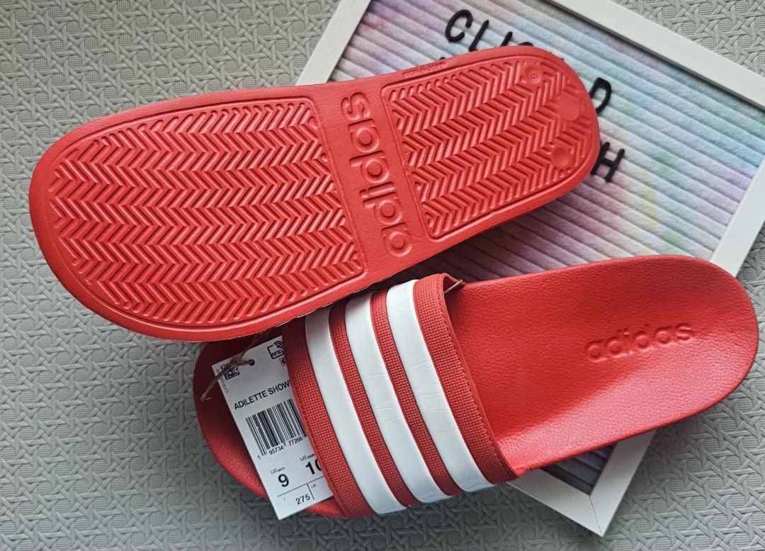 Adidas Adilette Shower Slides - Red (Category: Slippers & Slides) located in Malolos. Submitted by les0802 (Listing ID 1399116836, Image 3). Description: - Adidas Adilette Shower Slides - Color: Red with white stripes - Features Adidas logo - Size: US 9M/ 10W .