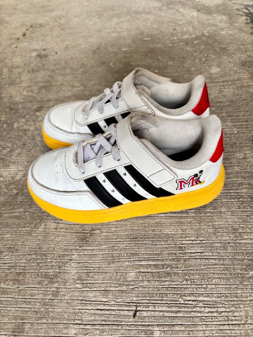 Adidas Mickey Mouse Kids Shoes (Category: Babies & Kids Fashion) located in Caloocan City. Submitted by loriebell (Listing ID 1399055754, Image 3). Description: - Adidas kids shoes with Mickey Mouse design - White upper with black stripes - Yellow soles - Velcro strap for easy wear - Red heel accent with Adidas logo - Size 10K.