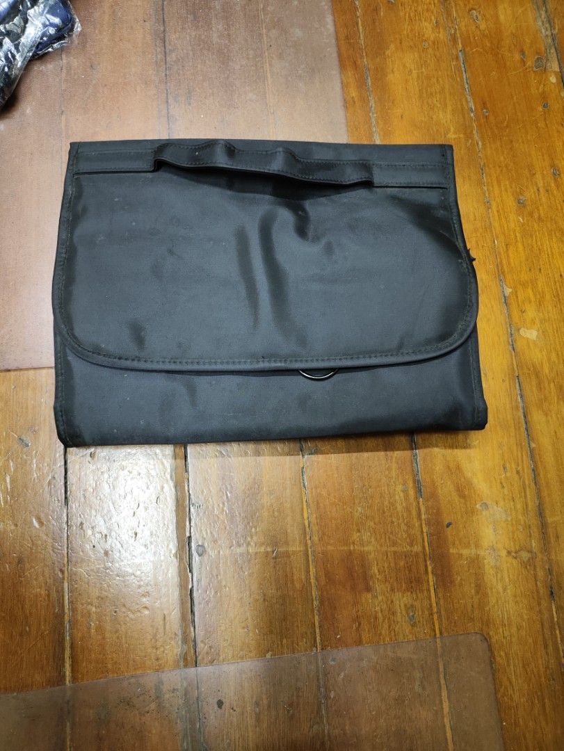 Black Hanging Travel Organizer (Category: Accessory Holder, Box & Organizers) located in Manila. Submitted by seepeeaylohyer (Listing ID 1399113881, Image 2). Description: - Black travel organizer - Multiple compartments and pockets for organization - Designed for toiletries and essentials - Durable, water-resistant material - Hangable for easy access - Folds up for compact storage - Convenient carrying handle.