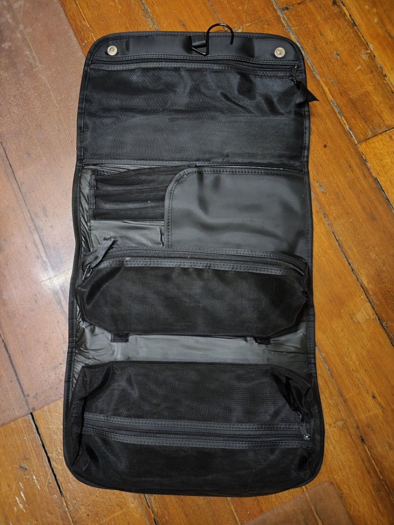 Black Hanging Travel Organizer (Category: Accessory Holder, Box & Organizers) located in Manila. Submitted by seepeeaylohyer (Listing ID 1399113881, Image 1). Description: - Black travel organizer - Multiple compartments and pockets for organization - Designed for toiletries and essentials - Durable, water-resistant material - Hangable for easy access - Folds up for compact storage - Convenient carrying handle.