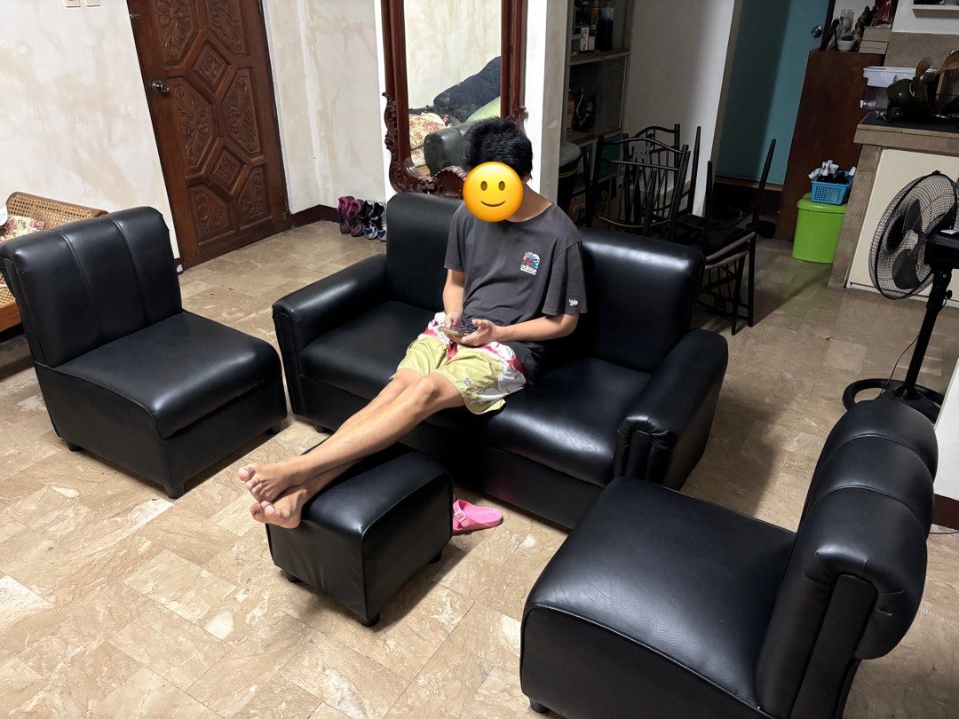 Black Leather Sofa Set with Ottoman (Category: Sofas) located in Quezon City. Submitted by nocommrnt00 (Listing ID 1399111465, Image 2). Description: - Complete black leather sofa set - Includes: three-seater sofa, two armchairs, and ottoman - Comfortable seating - Sleek and modern look - Ideal for living rooms and lounges - Like new! Used for 4 months only (No flaws/ issues) - RFS: no space.