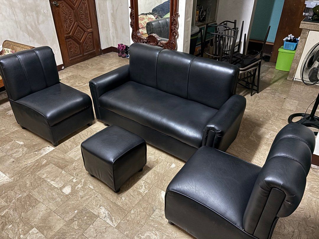 Black Leather Sofa Set with Ottoman (Category: Sofas) located in Quezon City. Submitted by nocommrnt00 (Listing ID 1399111465, Image 3). Description: - Complete black leather sofa set - Includes: three-seater sofa, two armchairs, and ottoman - Comfortable seating - Sleek and modern look - Ideal for living rooms and lounges - Like new! Used for 4 months only (No flaws/ issues) - RFS: no space.
