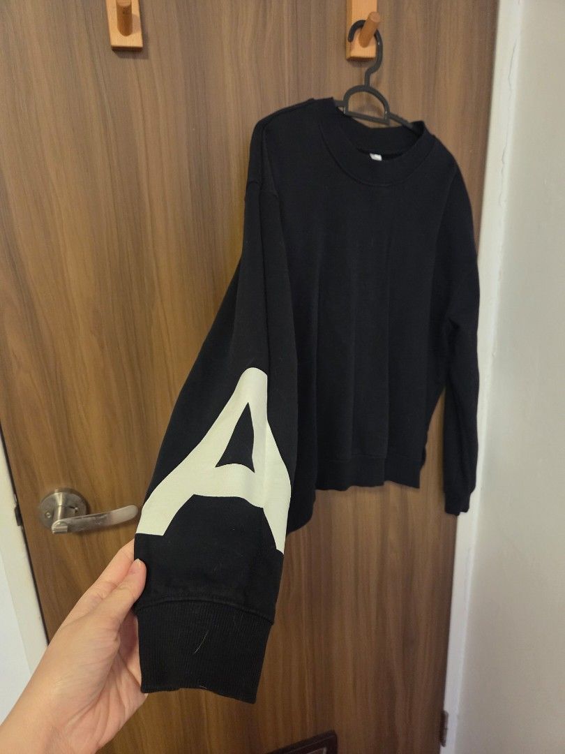 Black pullover (Category: Longsleeves) located in Singapore. Submitted by catntats (Listing ID 1399050720, Image 2). Description: price includes tracked shipping 60cm long 52cm ptp drop shoulder fleece lining, medium thickness letters M & A on arms selling to clear clost space! # sweater jumper crew neck .