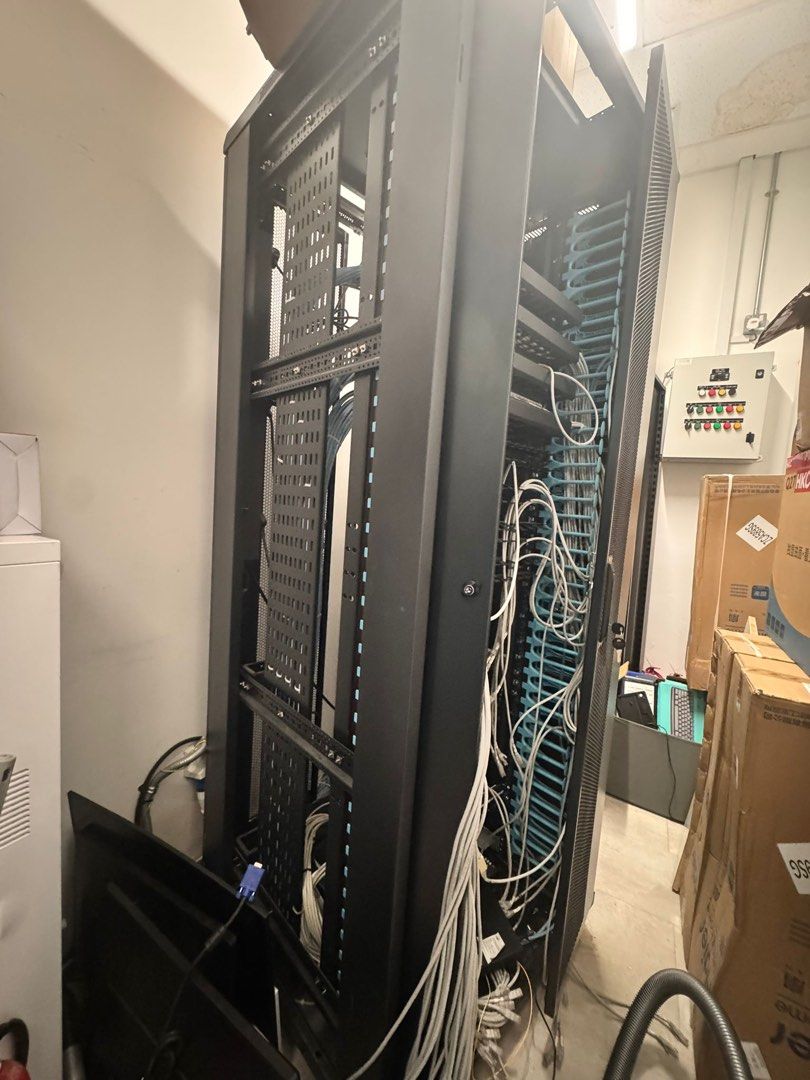 Black Server Rack (Category: Shelves, Cabinets & Racks) located in Singapore. Submitted by ecin0121 (Listing ID 1399080462, Image 1). Description: - Large black server rack - Features mounting rails - Perfect for network equipment - Ideal for home or office.