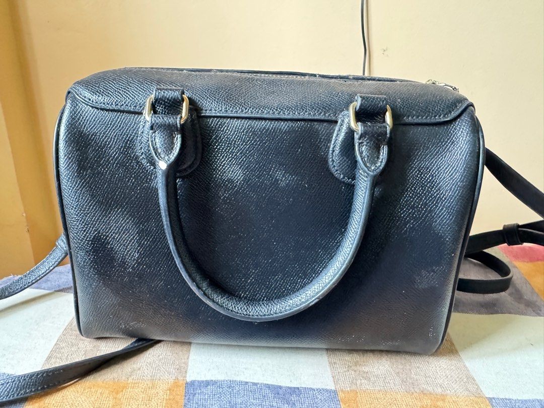 Coach Black Leather Crossbody Bag (Category: Luxury Bags & Wallets) located in Cavite. Submitted by aragurl (Listing ID 1399114384, Image 2). Description: - Authentic Coach crossbody bag - Top zipper closure - Double top handles - Detachable shoulder strap - Includes Coach tag - Interior pocket - Made in Vietnam - Minor wear on zipper and leather.