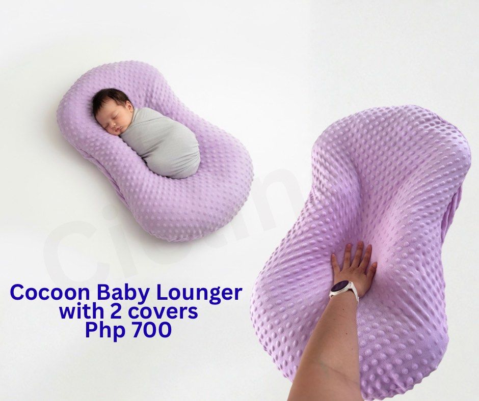 Cocoon Baby Lounger with 2 Covers (Category: Other Kids Furniture) located in Cavite. Submitted by cielinesid (Listing ID 1399065083, Image 1). Description: - Cocoon Baby Lounger (includes two covers) - Soft, purple design - Designed to cradle and support newborns - Provides a comfortable resting spot - Price: Php 700.