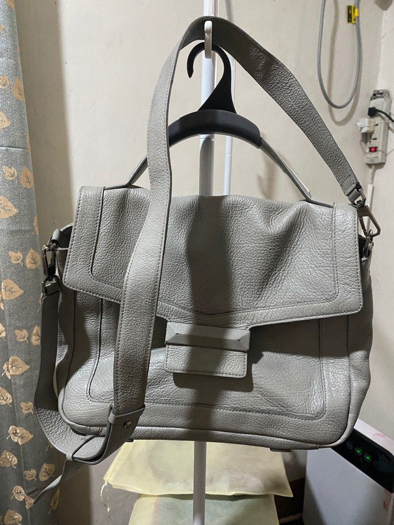 Decke Grey Leather Satchel (Category: Luxury Bags & Wallets) located in Caloocan City. Submitted by switspice (Listing ID 1399162713, Image 1). Description: - Grey Decke leather satchel handbag - Flap closure with metal accent - Top handle and detachable shoulder strap - Interior zippered pocket - Textured leather exterior - Matching grey interior lining.