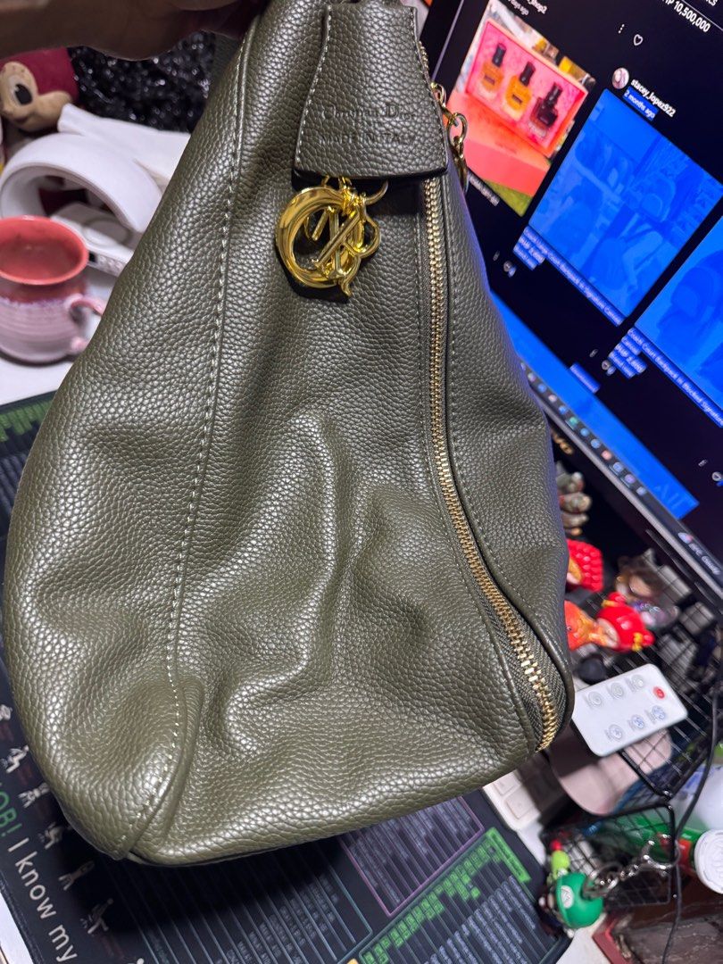 Dior Hobo Bag (Category: Luxury Bags & Wallets) located in Taytay. Submitted by jp4_fashion_hub (Listing ID 1399071713, Image 3). Description: 13.5” x 12” x 5.5” Olive green color Gold hardware Minimal signs of usage Authenticity not guaranteed .