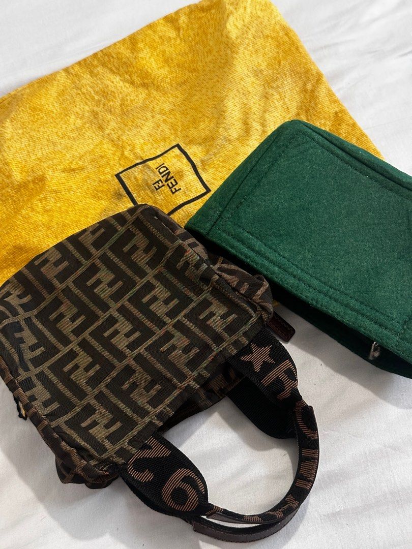 Fendi Mini Tote Bag (Category: Luxury Bags & Wallets) located in Batangas. Submitted by tidyandchic (Listing ID 1399072843, Image 1). Description: - Authentic Fendi mini tote bag - Iconic FF logo pattern - Top zipper closure - Leather handle - Includes dust bag and green felt insert - Interior leather tag with Fendi logo and serial number - Made in Italy.