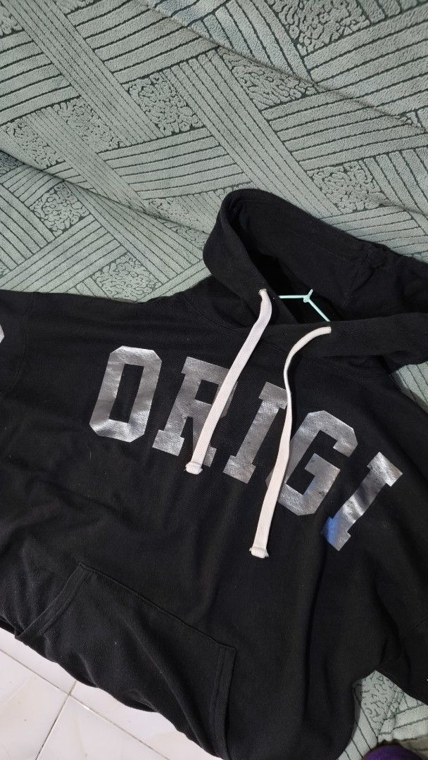 GAP Black Hoodie with Silver Print (Category: Hoodies) located in Rizal. Submitted by declutterwithliz (Listing ID 1399093817, Image 1). Description: - Black hoodie - Silver "ORIGI" and "ORIGINAL" print - Hood with white drawstrings - Front pocket - Silver print on sleeves - Casual and comfortable.