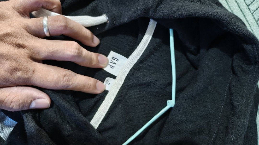 GAP Original Hoodie (Category: Hoodies) located in Rizal. Submitted by declutterwithliz (Listing ID 1399093730, Image 2). Description: - Original GAP hoodie - Size: Medium - Features: - Drawstring hood - Kangaroo pocket - Prints: - "ORIGINAL" on front - "GAP ORIGINAL" on sleeves - Authentic with GAP logo tag.