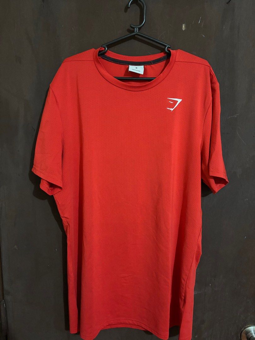 Gymshark Red T-shirt (Category: Activewear) located in Manila. Submitted by kendez (Listing ID 1399055223, Image 1). Description: - Gymshark red t-shirt - Crew neck - Short sleeves - Gymshark logo on chest - Made of athletic material RFS: Doesn’t fit me anymore.