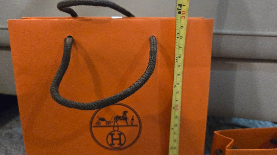 Hermes Paper bags (Category: Luxury Accessories) located in Paranaque City. Submitted by karenmn (Listing ID 1399131317, Image 3). Description: Authentic Hermes paper bags - From GB boutique - Features the classic Hermes orange color - Available in two sizes (see photos for exact measurements) - Excellent condition - Ideal for gifting or personal use Asking: Php 1,000 + sf No rush pls MOP: Gcash SF c/o buyer.