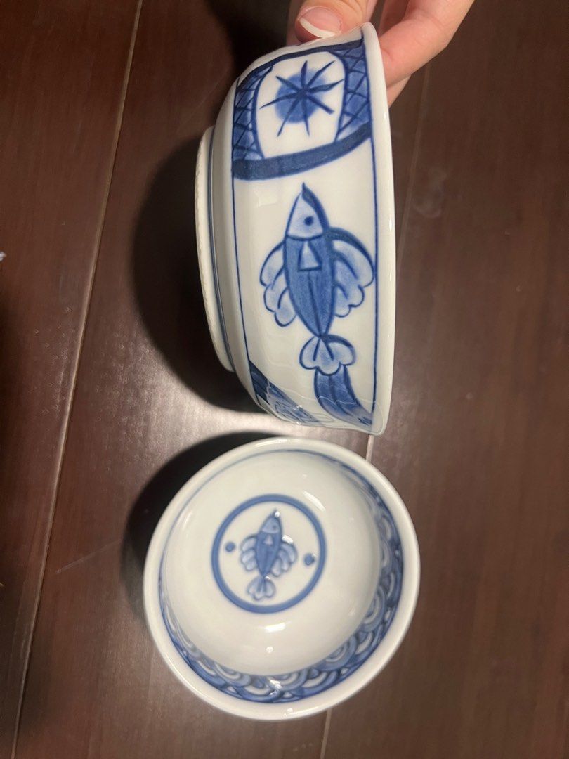 Japanese Bowls with Fish Design (Category: Dinnerware & Cutlery) located in Quezon City. Submitted by simp4harry (Listing ID 1399209822, Image 2). Description: - Set of two Japanese bowls - Features a blue and white fish design - Includes a wave pattern around the rim - One bowl is larger than the other - Ideal for serving rice, soup, or small dishes - Adds a charming touch to your kitchen.