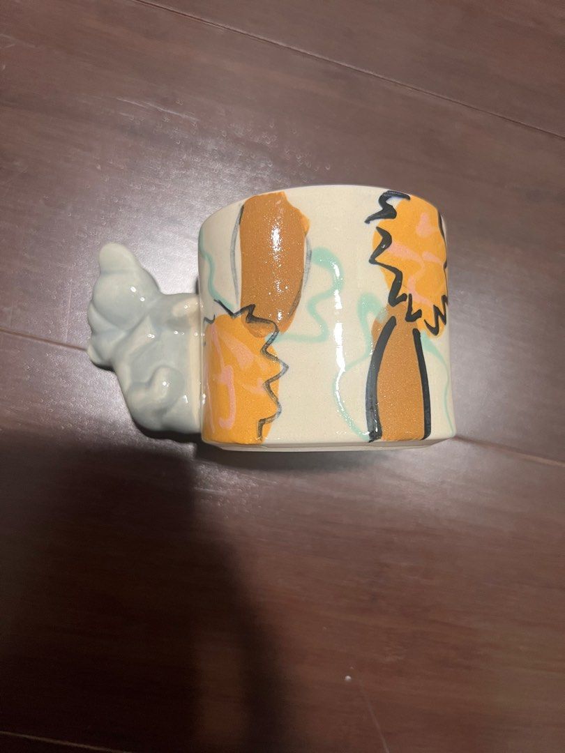 Koala Dingo Clay Australia Mug (Category: Coffee & Tea Tableware) located in Quezon City. Submitted by simp4harry (Listing ID 1399211418, Image 2). Description: - Ceramic mug with a charming koala design. - Features a unique koala figure as the handle. - Light-colored interior. - Painted exterior with koala and tree illustrations. - Ideal for coffee or tea..