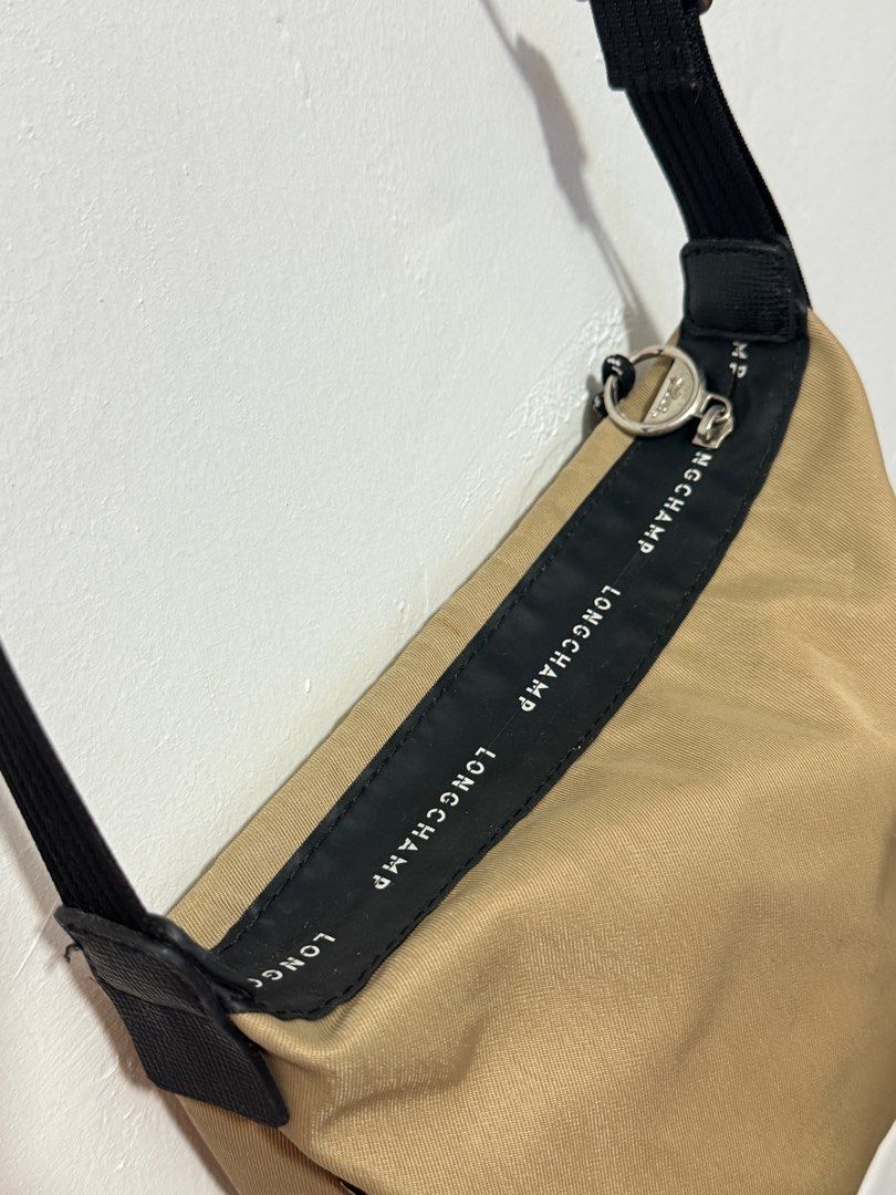 Longchamp Le Pliage Energy Shoulder Bag (Category: Luxury Bags & Wallets) located in Quezon City. Submitted by chaigutz (Listing ID 1399096139, Image 2). Description: NGA - NOT GUARANTEED AUTHENTIC. You can self-authenticate. - Longchamp Le Pliage Energy shoulder bag - Tan nylon body - Black strap and trim - Zip closure - Clean interior - Longchamp logo detail on strap - Small logo tag.