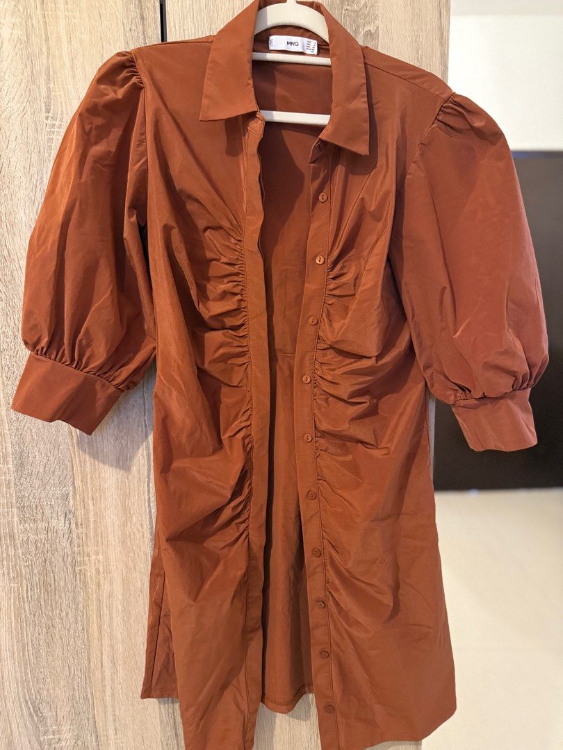 Mango Ruched Dress (Category: Dresses) located in Cebu City. Submitted by xishy (Listing ID 1399136542, Image 1). Description: - Mango dress in rich brown - Collared neckline - Button-down front - Ruched detailing - Puff sleeves - Flattering silhouette - Size S.