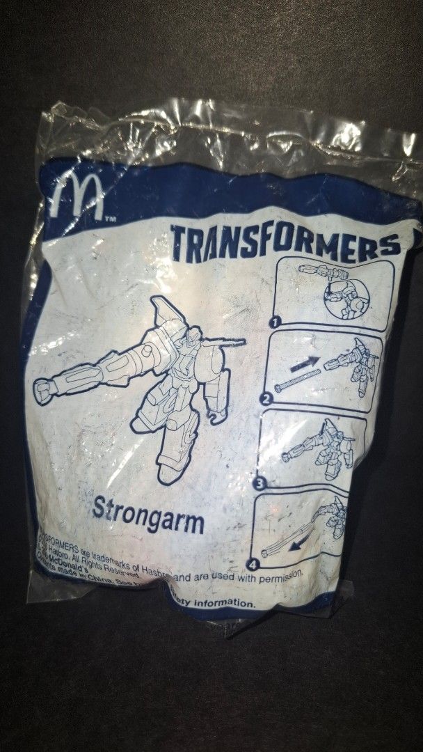 McDonald's Transformers Strongarm Toy (Category: Character Goods) located in Taguig. Submitted by eagallano (Listing ID 1399094056, Image 1). Description: - Sealed McDonald's Transformers Strongarm toy.