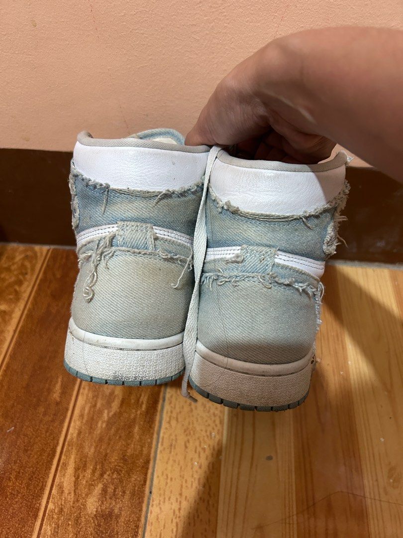 Nike Air Jordan 1 High Denim (Category: Sneakers) located in San Leonardo. Submitted by ur_chai (Listing ID 1399121026, Image 3). Description: - Air Jordan 1 High sneakers - Denim design with white and blue accents - High-top silhouette - Nike Air logo on the tongue - Gold-colored Jordan charms on laces - Unique, worn denim aesthetic Bought for 11k Issue: heavily used, no box.