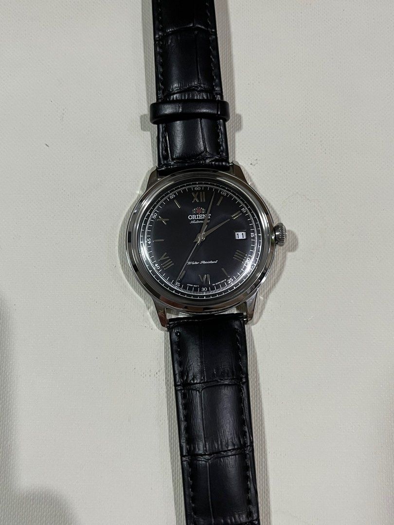 Orient Automatic Watch (Category: Men's Watches) located in Cainta. Submitted by saminjess (Listing ID 1399061123, Image 2). Description: Orient Bambino black dial Automatic Replaced leather strap (with original strap) Watch only ₱10,500 Loc: cainta,rizal **This is a pre-owned/vintage watch and may have signs of wear. Kindly manage your expectations. Cannot be returned once sold..